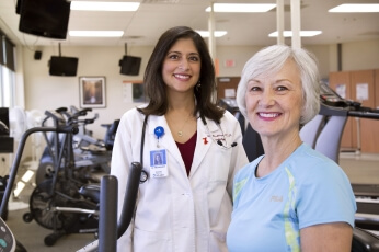 Dr. Disha Mookherjee, cardiologist, with her patient, Dianne Pederson